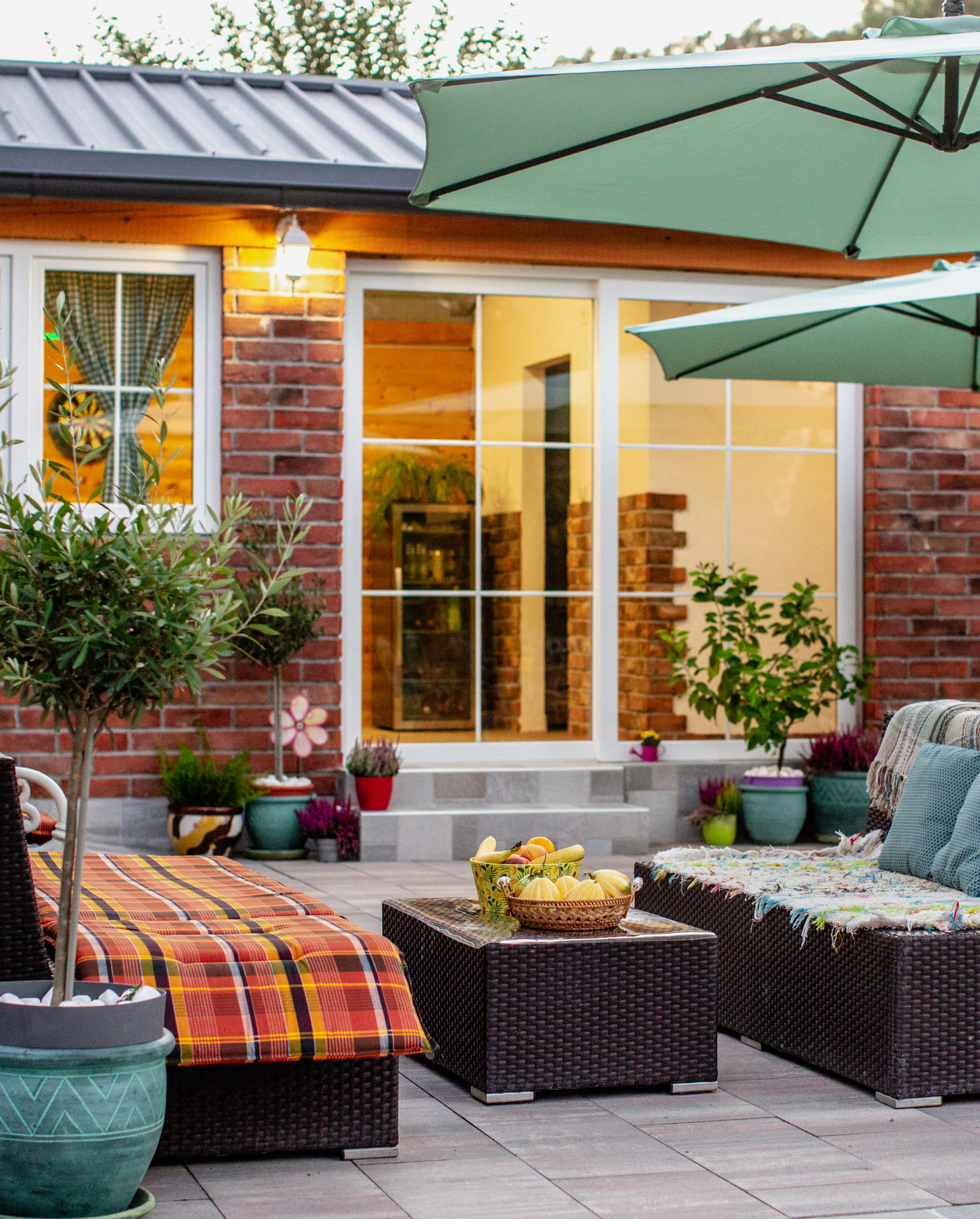 A cozy patio - featuring a table surrounded by chairs, perfect for outdoor dining and relaxation.